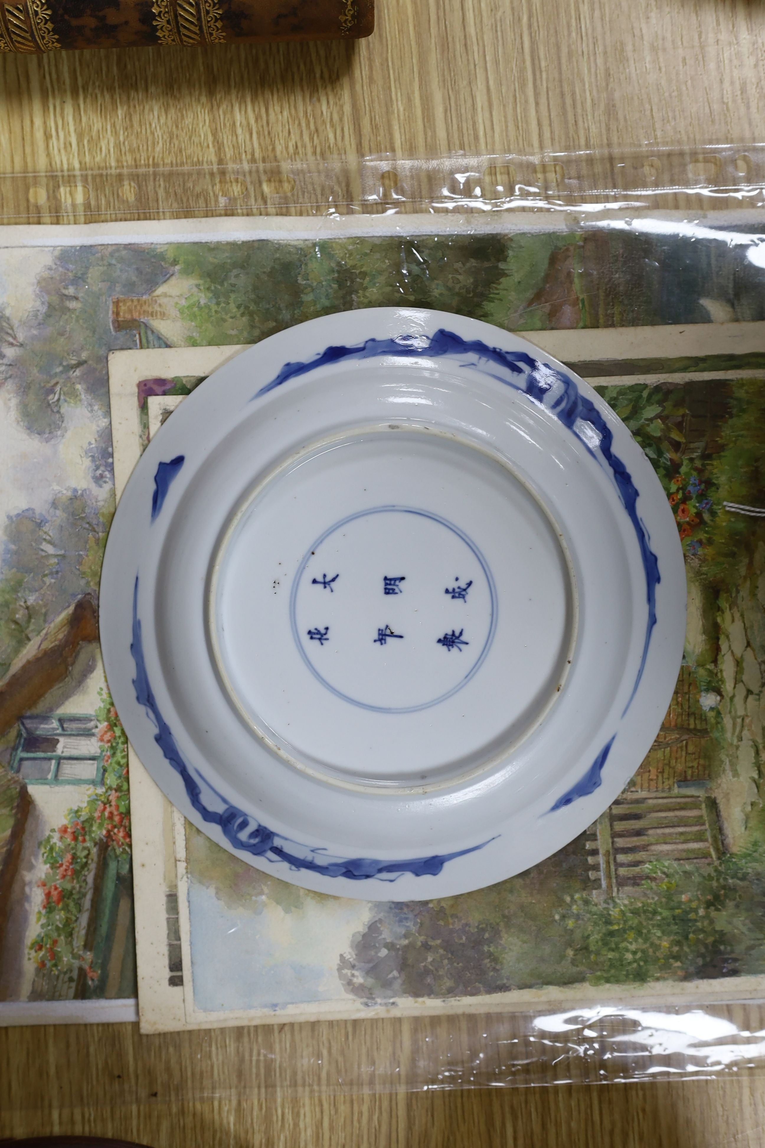 Two Chinese blue and white plates, Kangxi period, one with Kangxi mark the other a Chenghua mark, 21 cms diameter